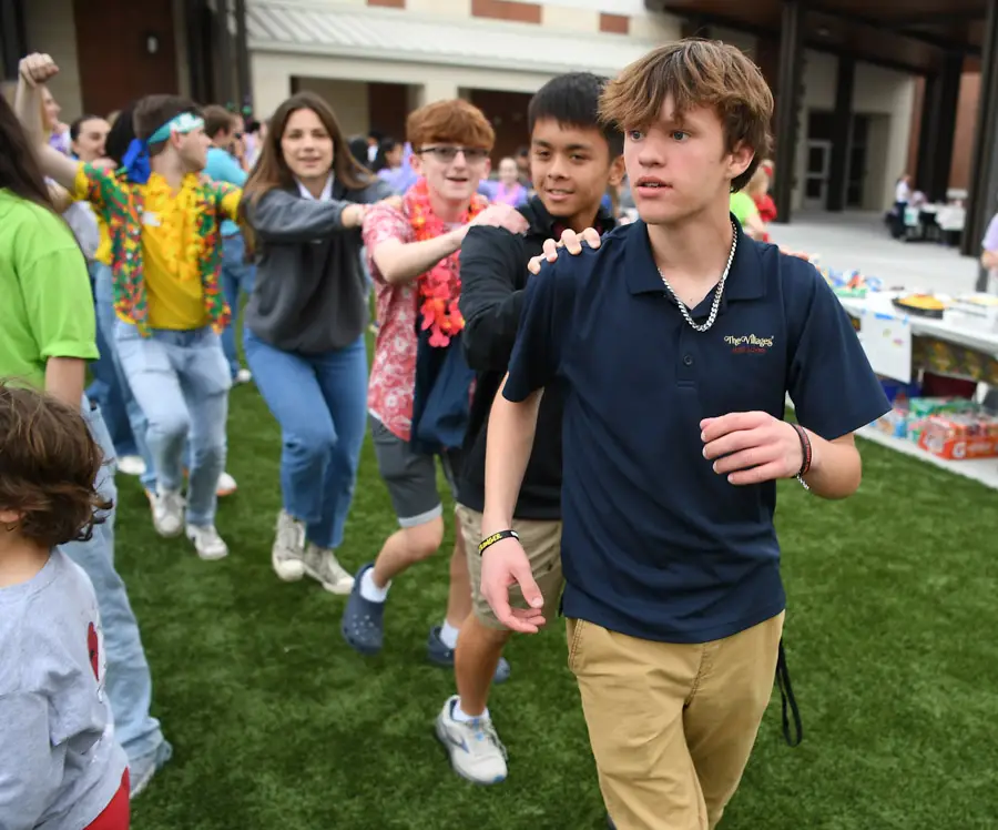 The Villages High School Key Club students doing the conga.